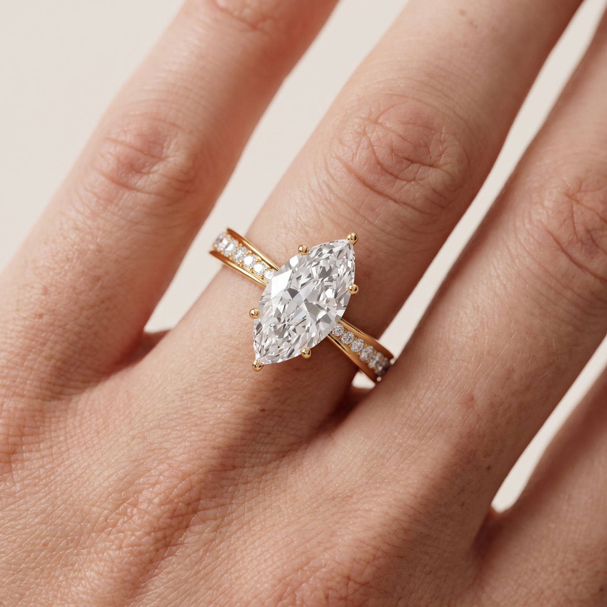 Rhea Sidestone Pavé Marquise Diamond Engagement Ring in Yellow Gold - lifestyle.jpg