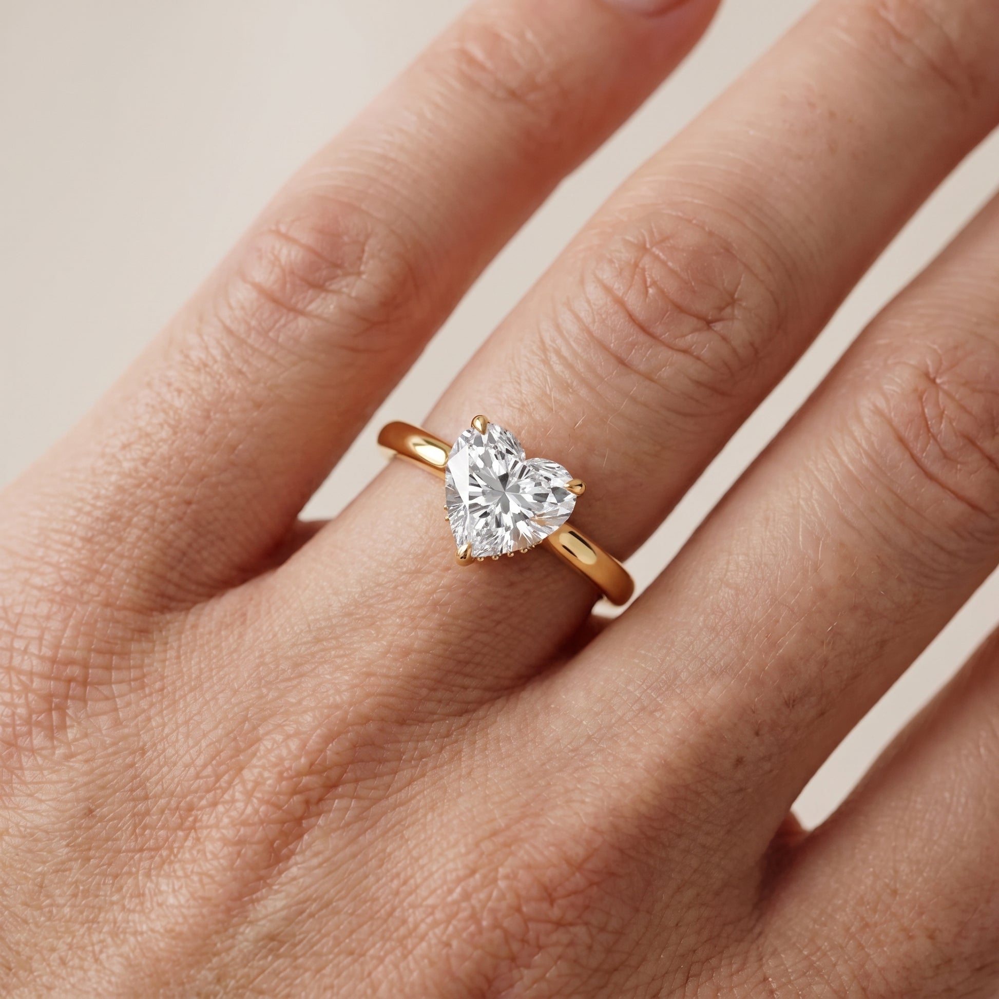 Mena Hidden Halo Heart Diamond Engagement Ring in Yellow Gold - lifestyle.jpg