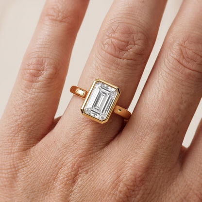 Jolie Bezel Solitaire Emerald Diamond Engagement Ring in Yellow Gold - lifestyle.jpg