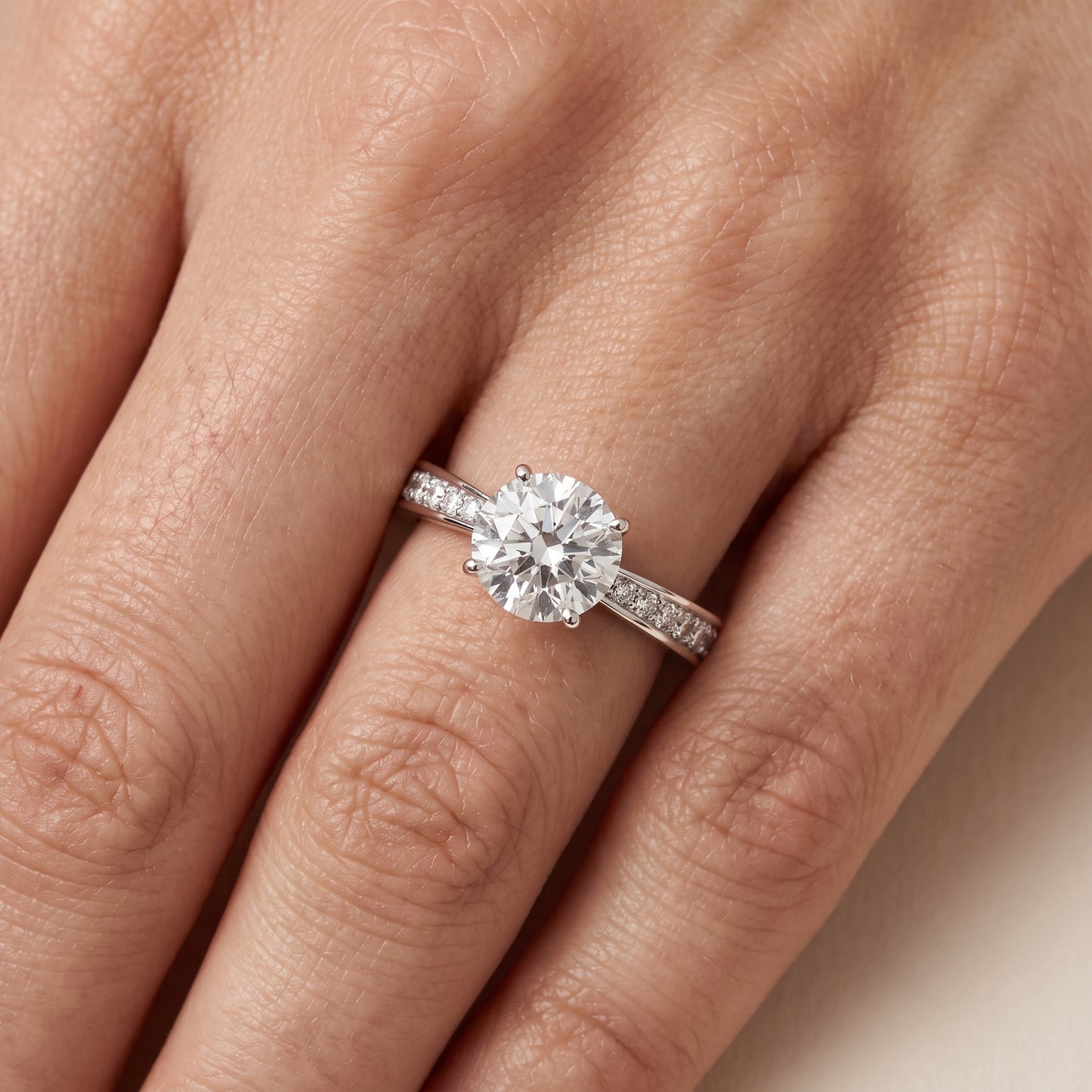 Rhea Sidestone Pavé Round Diamond Engagement Ring in Platinum - lifestyle.jpg