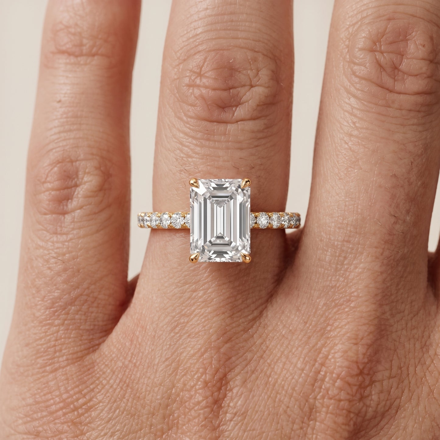 Juna French Pavé Solitaire Emerald Diamond Engagement Ring in Yellow Gold - lifestyle.jpg