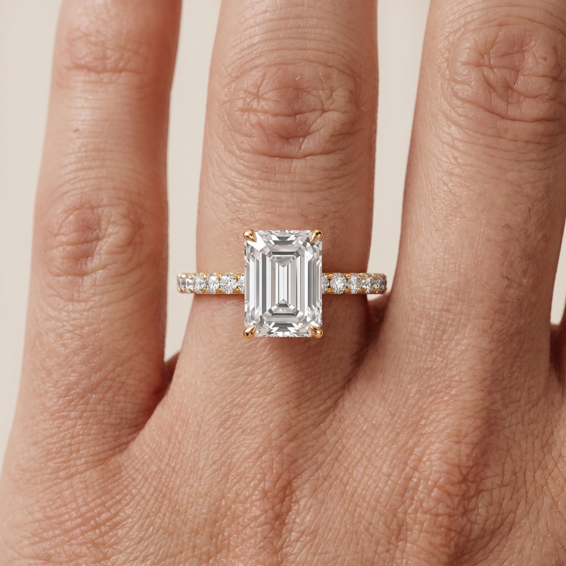Juna French Pavé Solitaire Emerald Diamond Engagement Ring in Yellow Gold - lifestyle.jpg