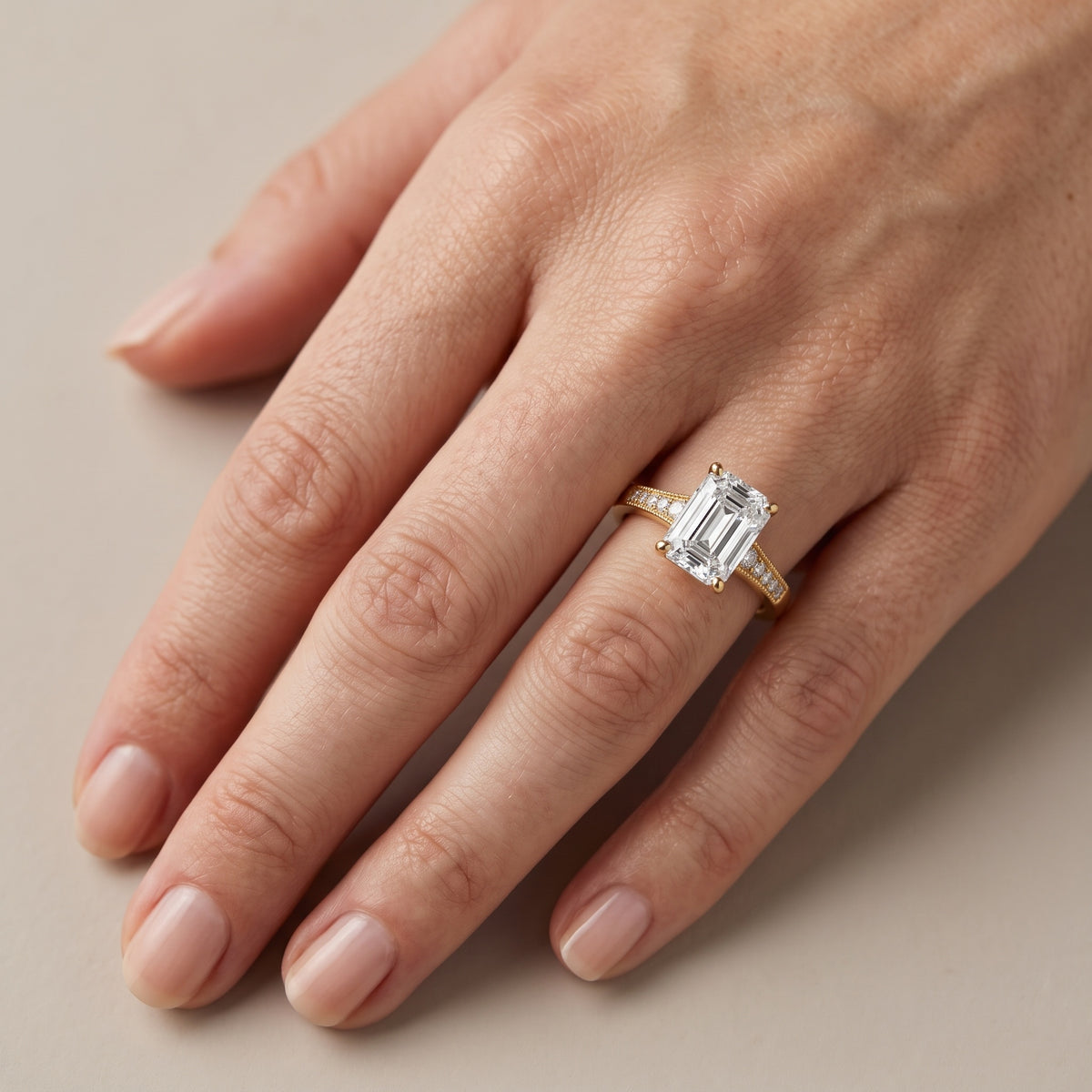 Fenella Milgrain Pavé Emerald Diamond Engagement Ring in Rose Gold - lifestyle.jpg