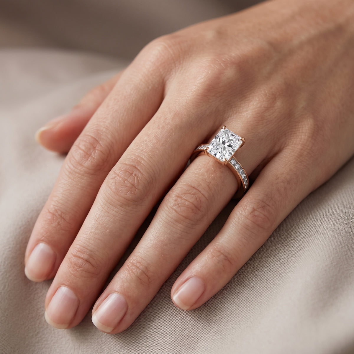 Brielle Channel Set Solitaire Radiant Diamond Engagement Ring in Rose Gold - lifestyle.jpg
