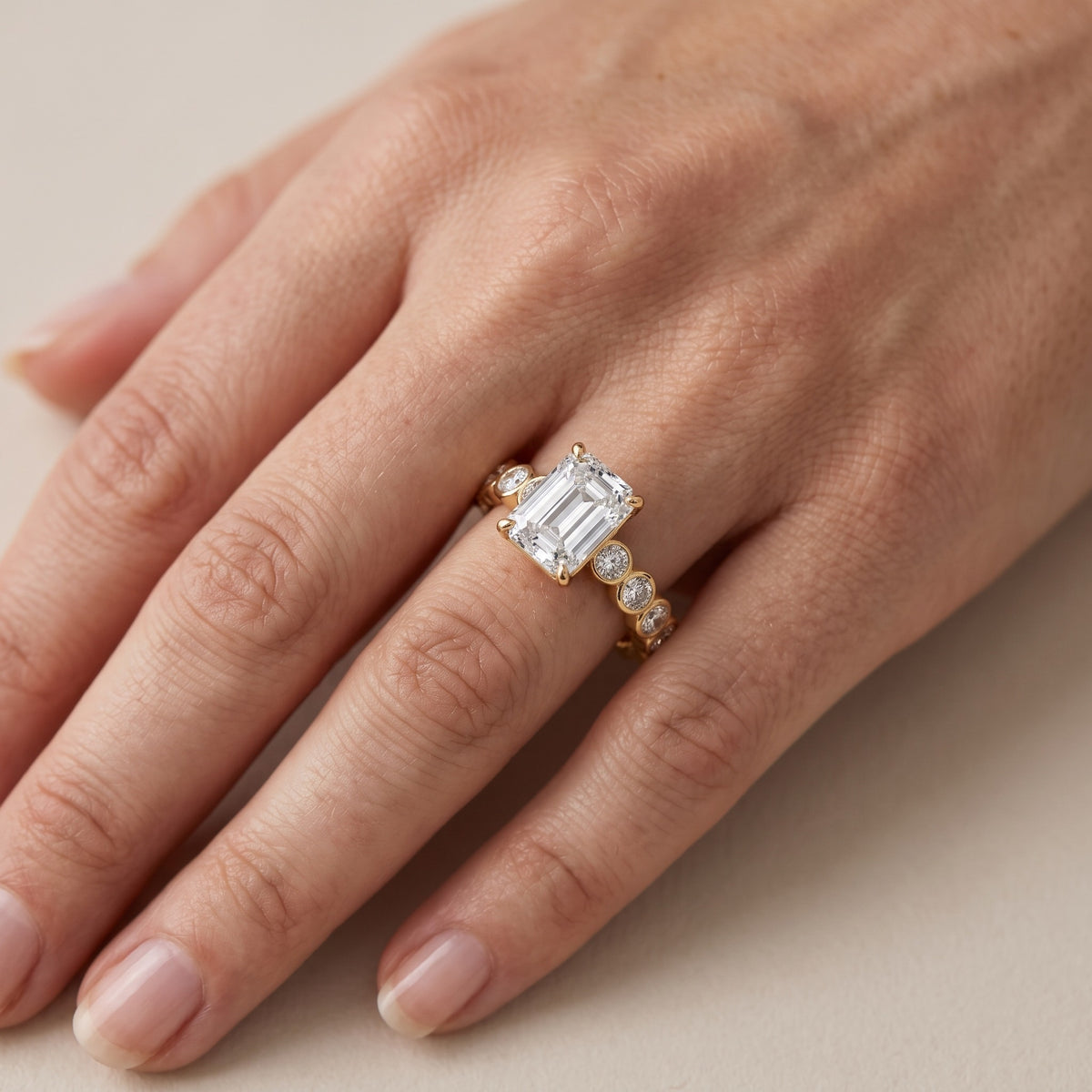Edie Beaded Bezel Emerald Diamond Engagement Ring in Yellow Gold - lifestyle.jpg