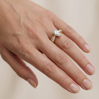 Noor Channel Set Sidestone Pear Diamond Engagement Ring in Yellow Gold - lifestyle.jpg