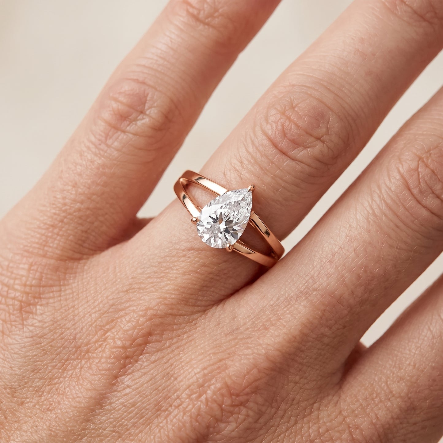 Giselle Solitaire Split Shank Pear Diamond Engagement Ring in Rose Gold - lifestyle.jpg
