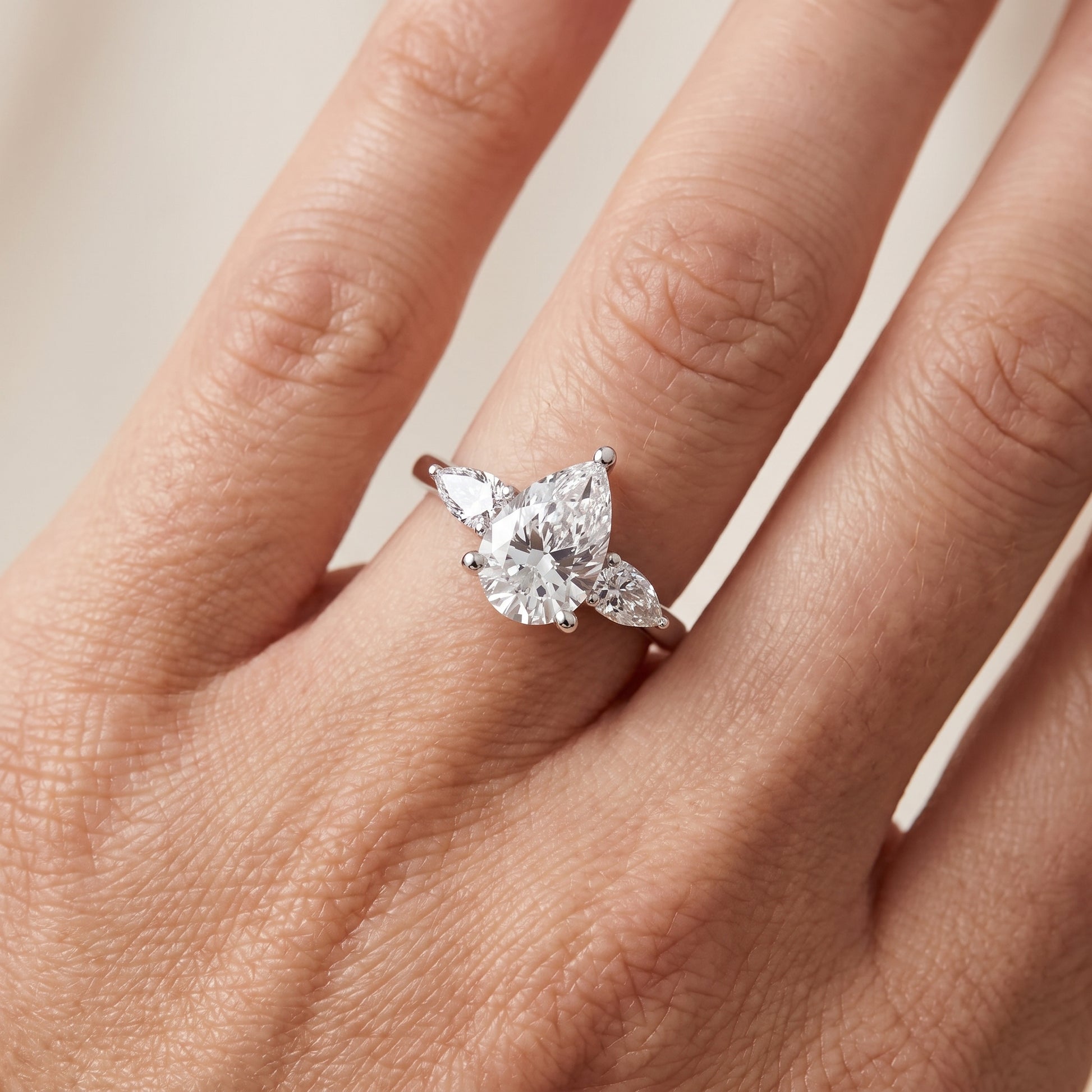 Faye Three-Stone Trellis Pear Diamond Ring in Platinum - lifestyle.jpg