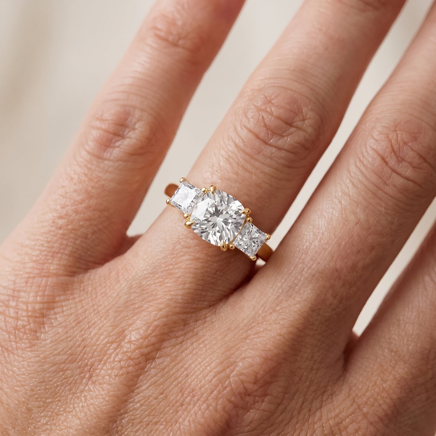 Sienna Three-Stone Cushion Diamond Ring in Yellow Gold - lifestyle.jpg