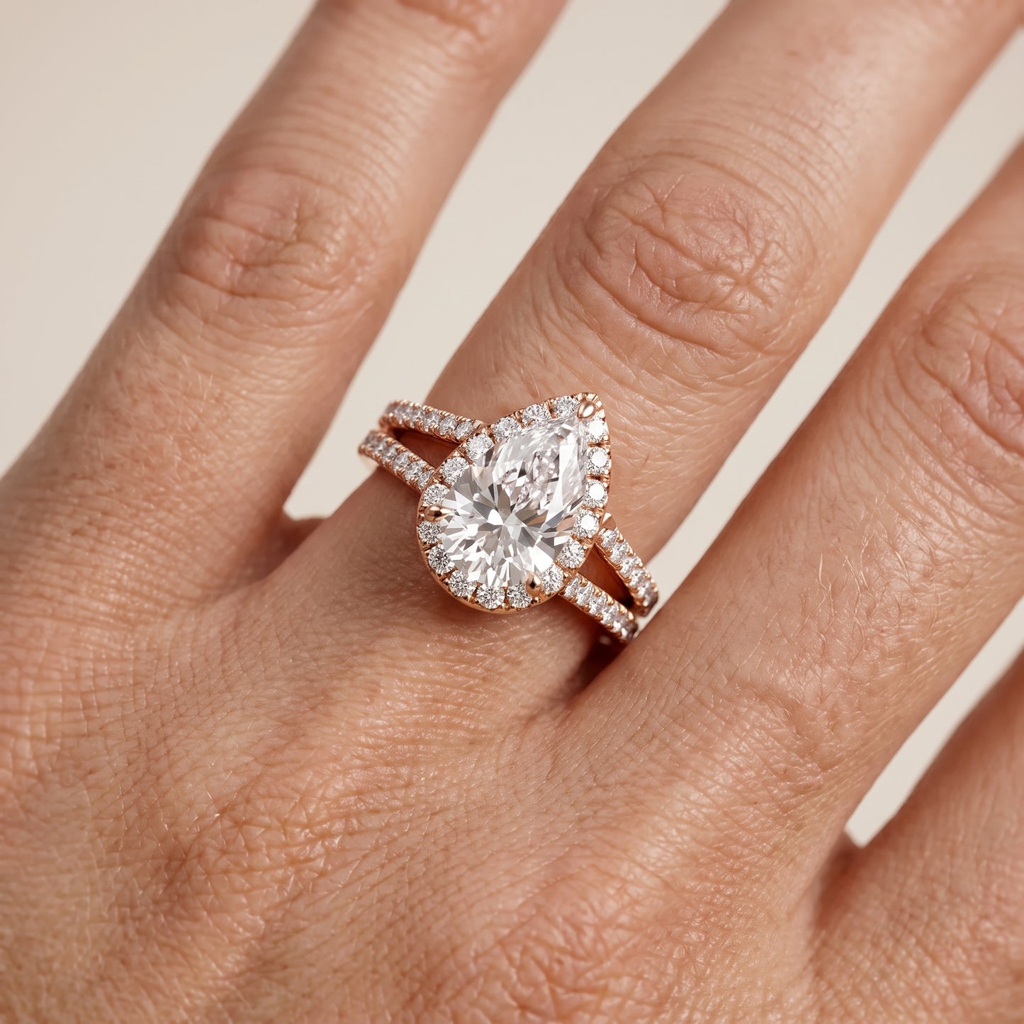 Kira Halo Split Shank Pear Diamond Engagement Ring in Rose Gold - lifestyle.jpg