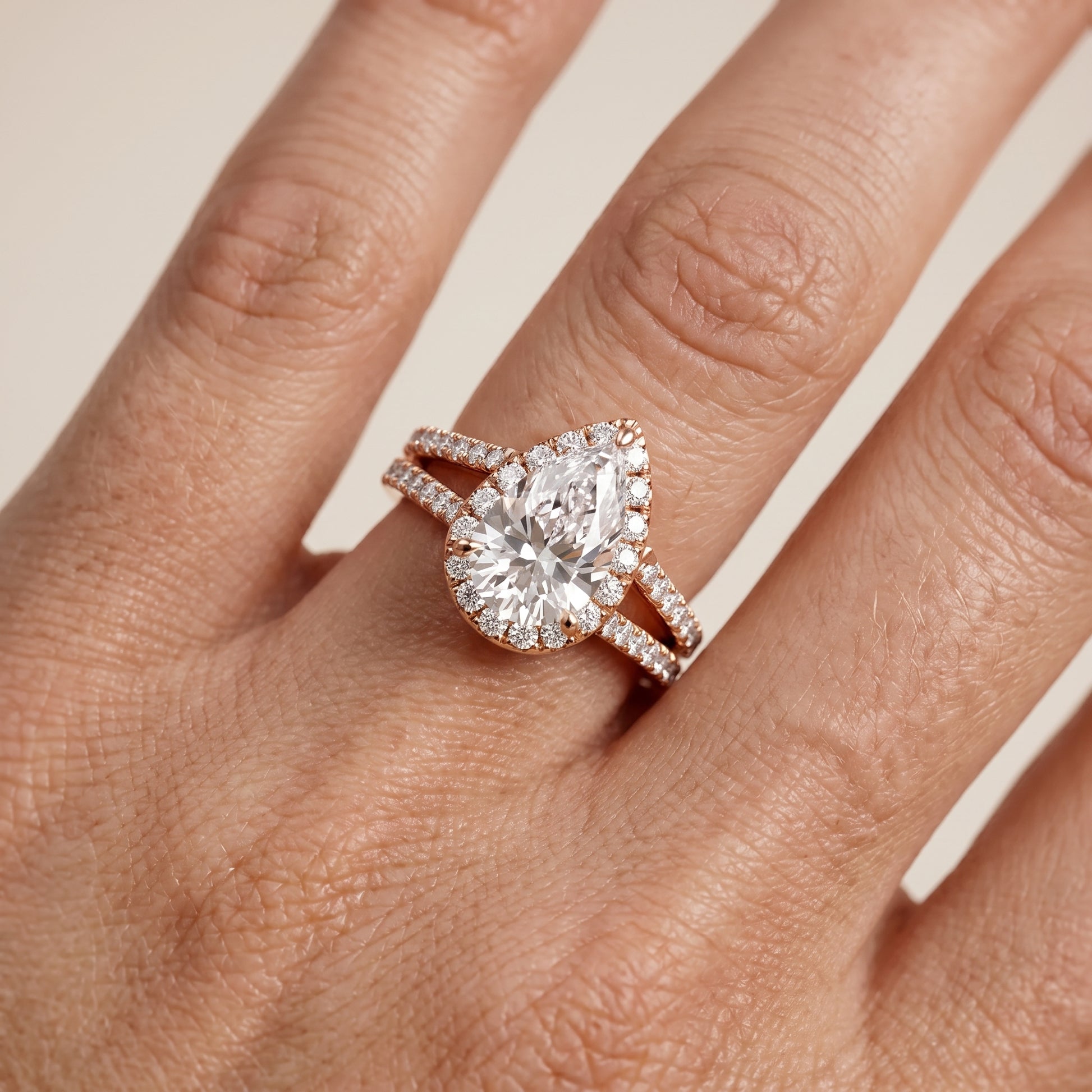 Kira Halo Split Shank Pear Diamond Engagement Ring in Rose Gold - lifestyle.jpg