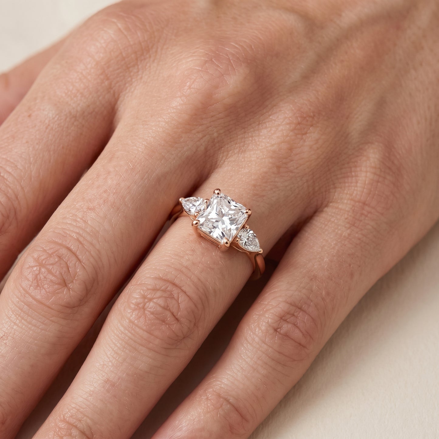 Faye Three-Stone Trellis Radiant Diamond Ring in Rose Gold - lifestyle.jpg