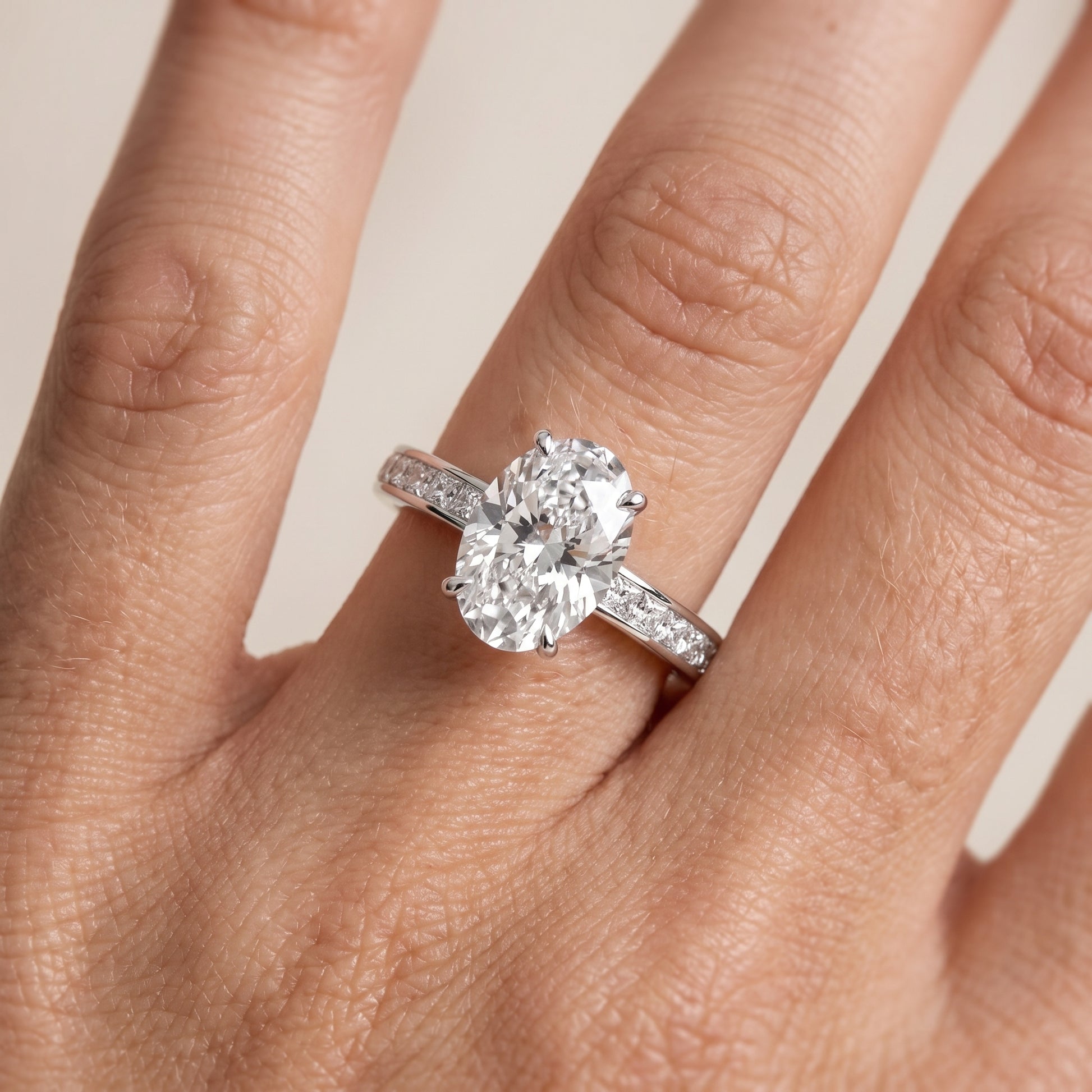 Brielle Channel Set Solitaire Oval Diamond Ring in Platinum - lifestyle.jpg