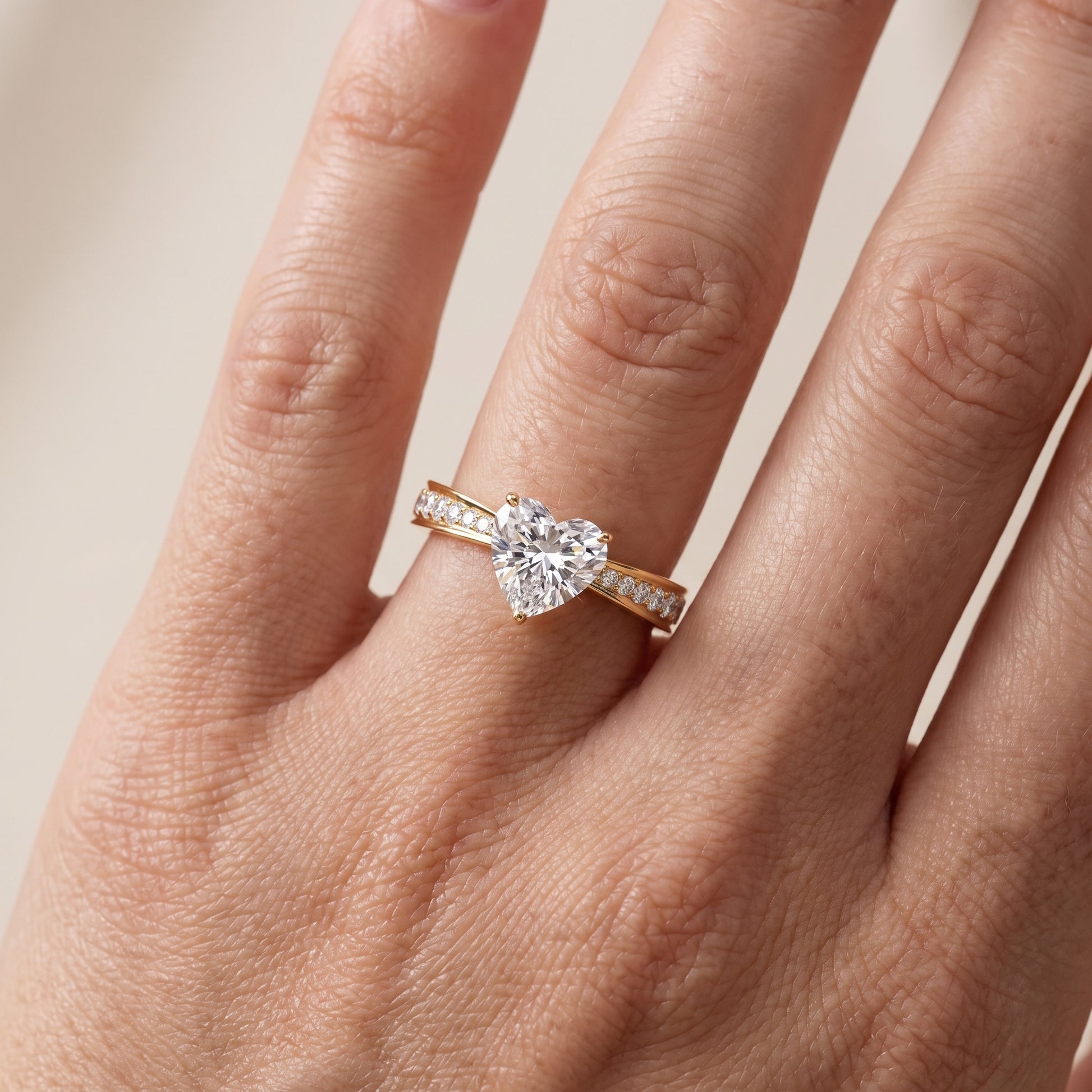 Rhea Sidestone Pavé Heart Diamond Engagement Ring in Yellow Gold - lifestyle.jpg