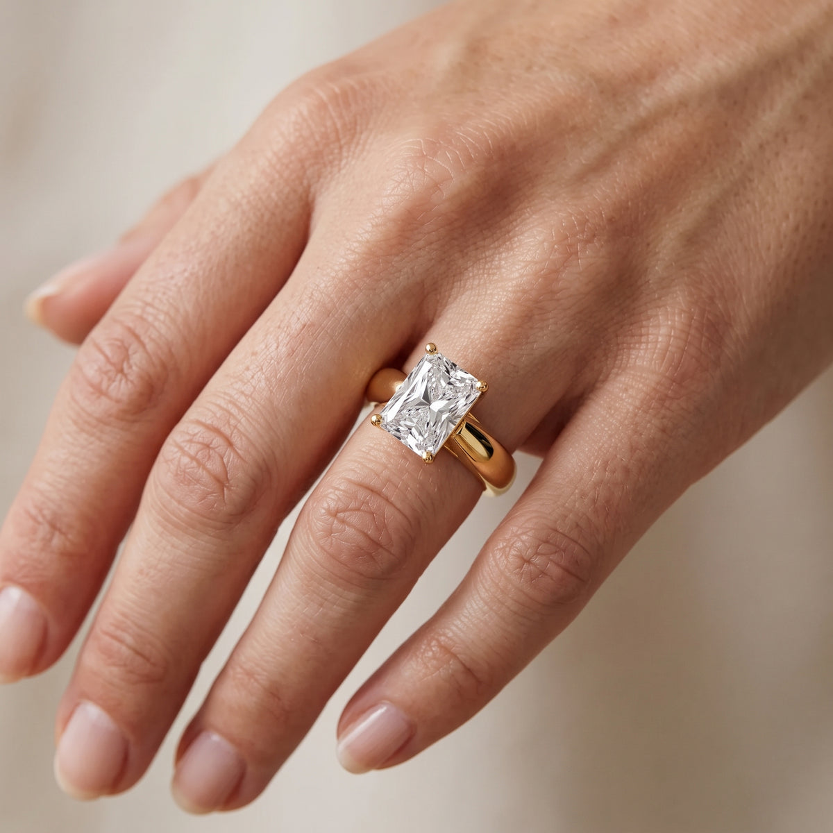 Talia Solitaire Twist Radiant Diamond Engagement Ring in Yellow Gold - lifestyle.jpg