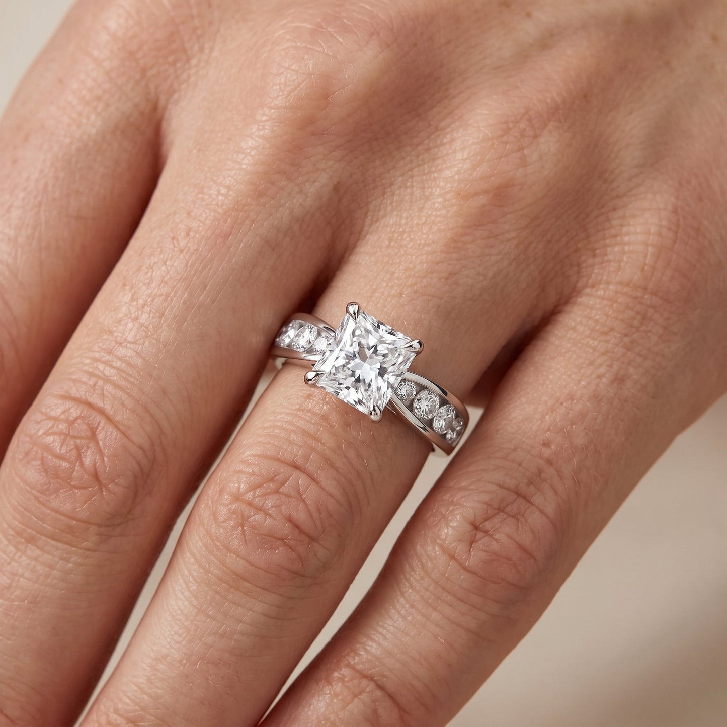 Noor Channel Set Sidestone Radiant Diamond Engagement Ring in Platinum - lifestyle.jpg