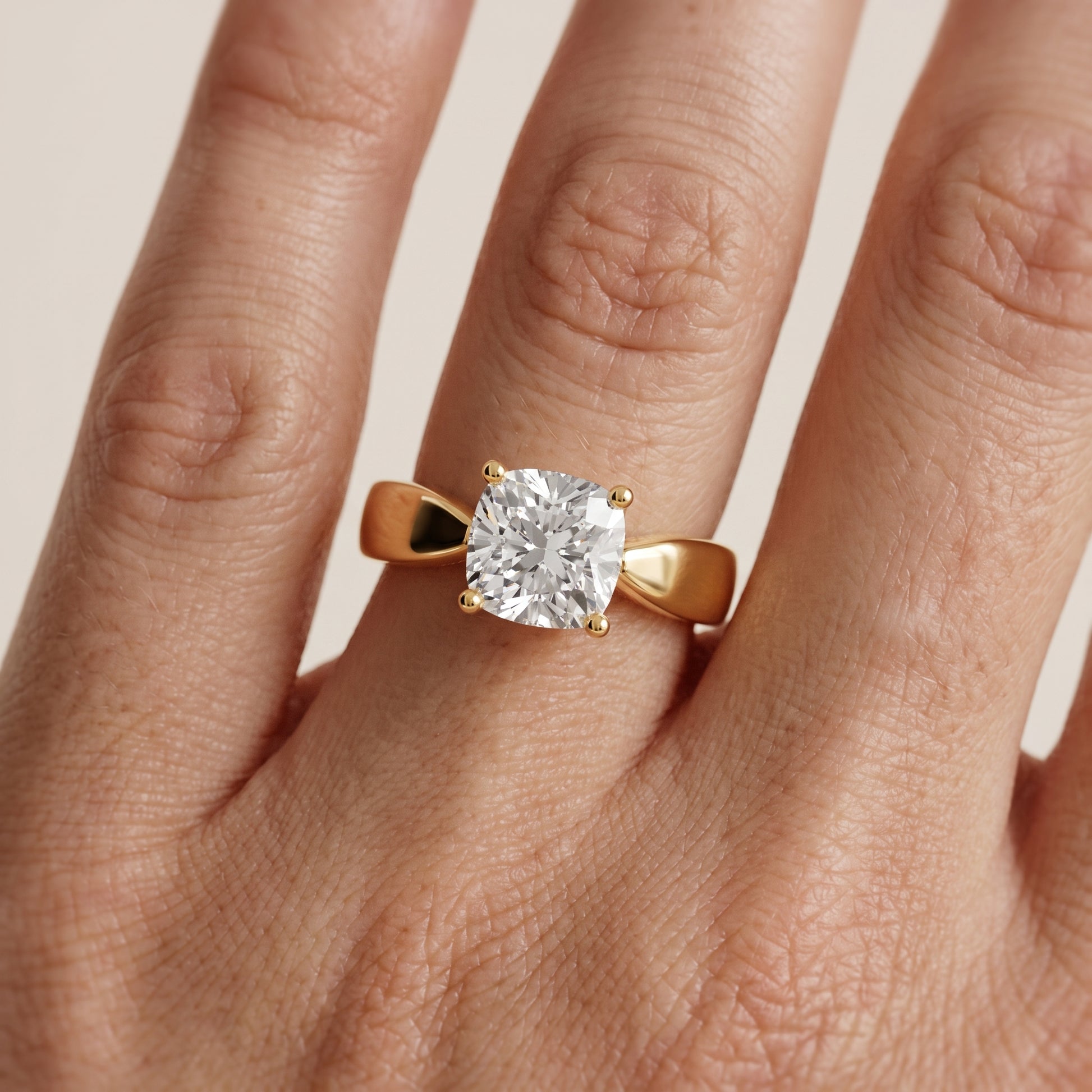 Talia Solitaire Twist Cushion Diamond Engagement Ring in Yellow Gold - lifestyle.jpg