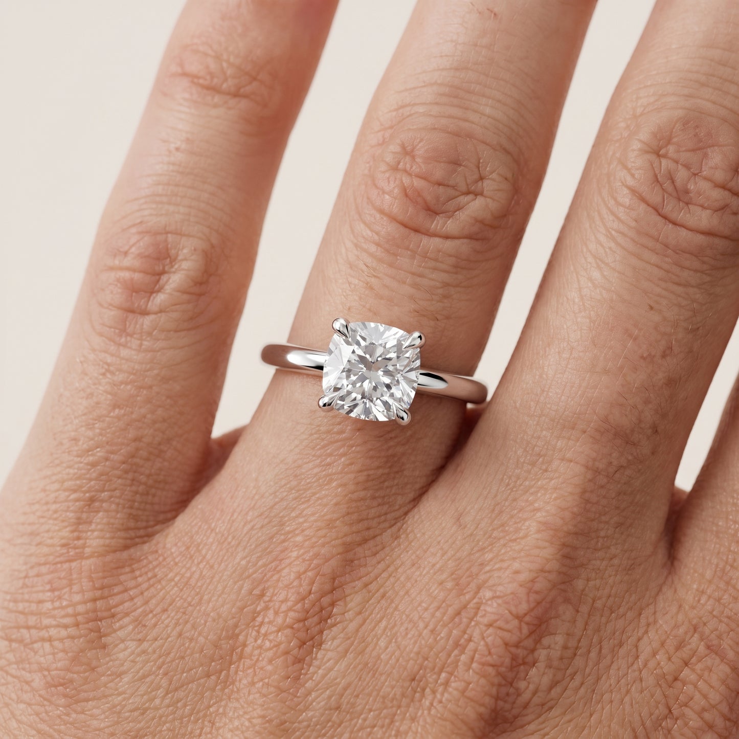 Nella Petite Solitaire Cushion Diamond Engagement Ring in Platinum - lifestyle.jpg