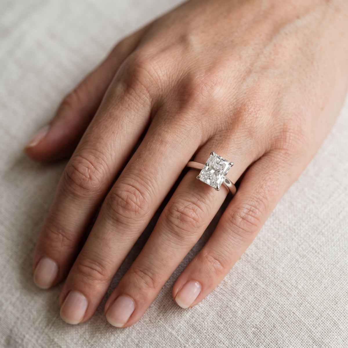 Kalia Knife Edge Solitaire Radiant Diamond Engagement Ring in Platinum - lifestyle.jpg