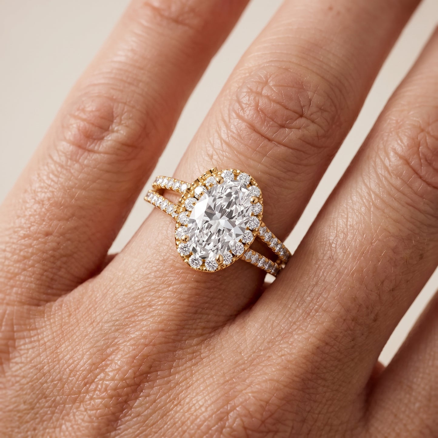 Kira Halo Split Shank Oval Diamond Engagement Ring in Yellow Gold - lifestyle.jpg