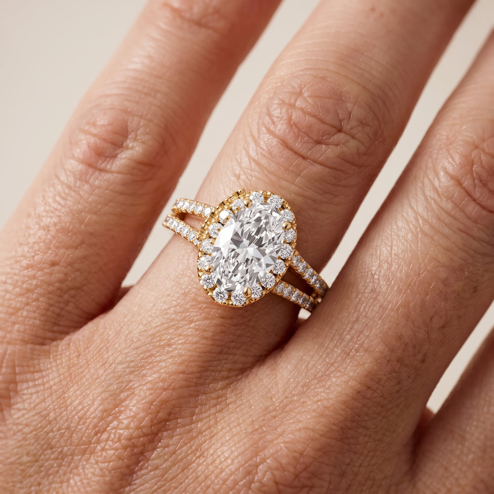 Kira Halo Split Shank Oval Diamond Engagement Ring in Yellow Gold - lifestyle.jpg