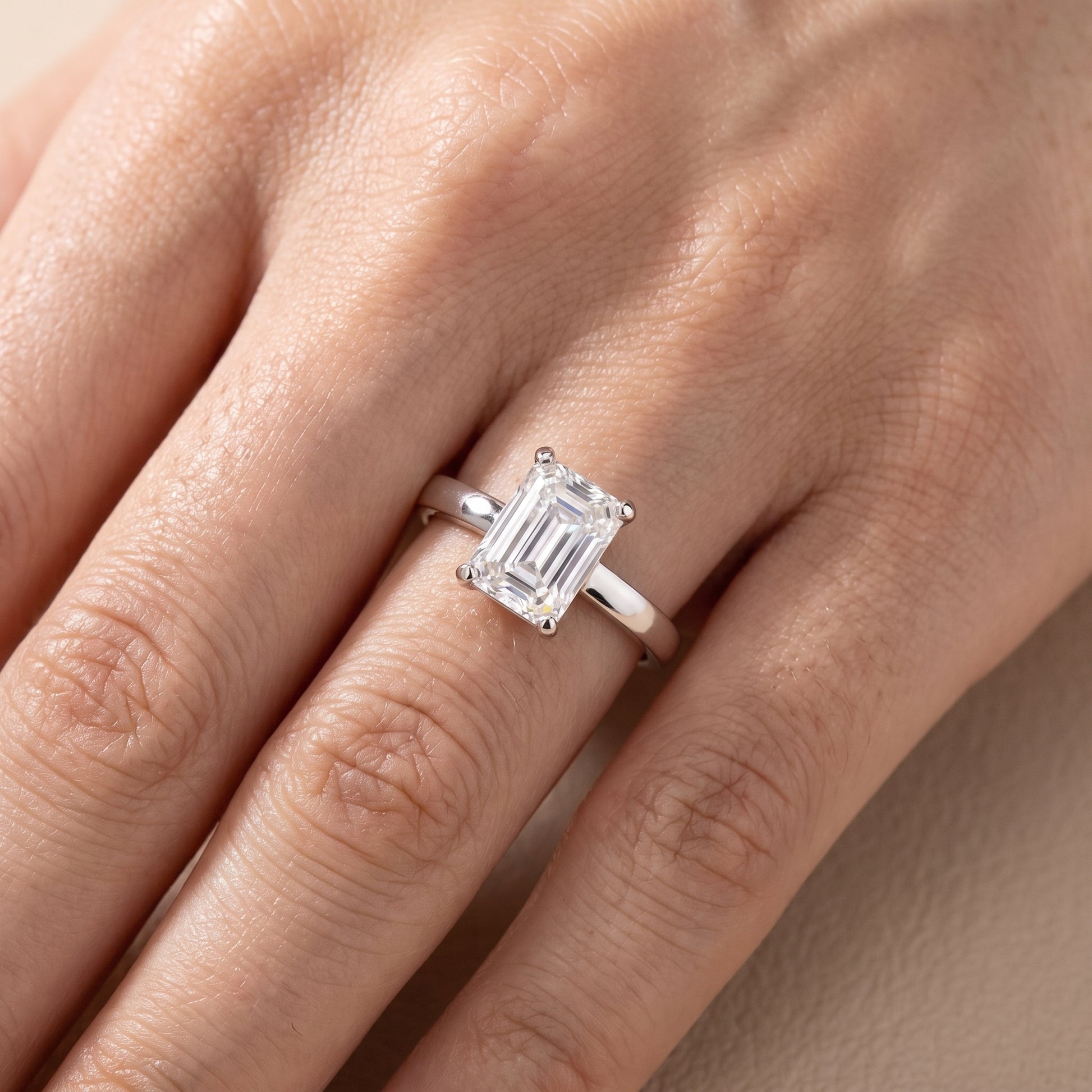 Delia Solitaire Emerald Diamond Engagement Ring in Platinum - lifestyle.jpg