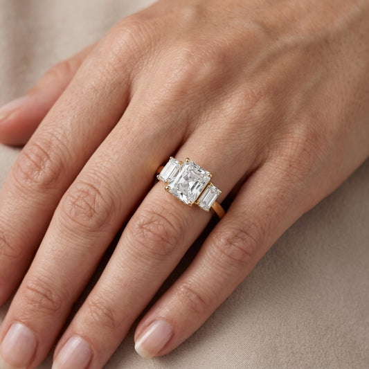 Marian Three-Stone Hidden Halo Radiant Diamond Engagement Ring in Yellow Gold - lifestyle.jpg