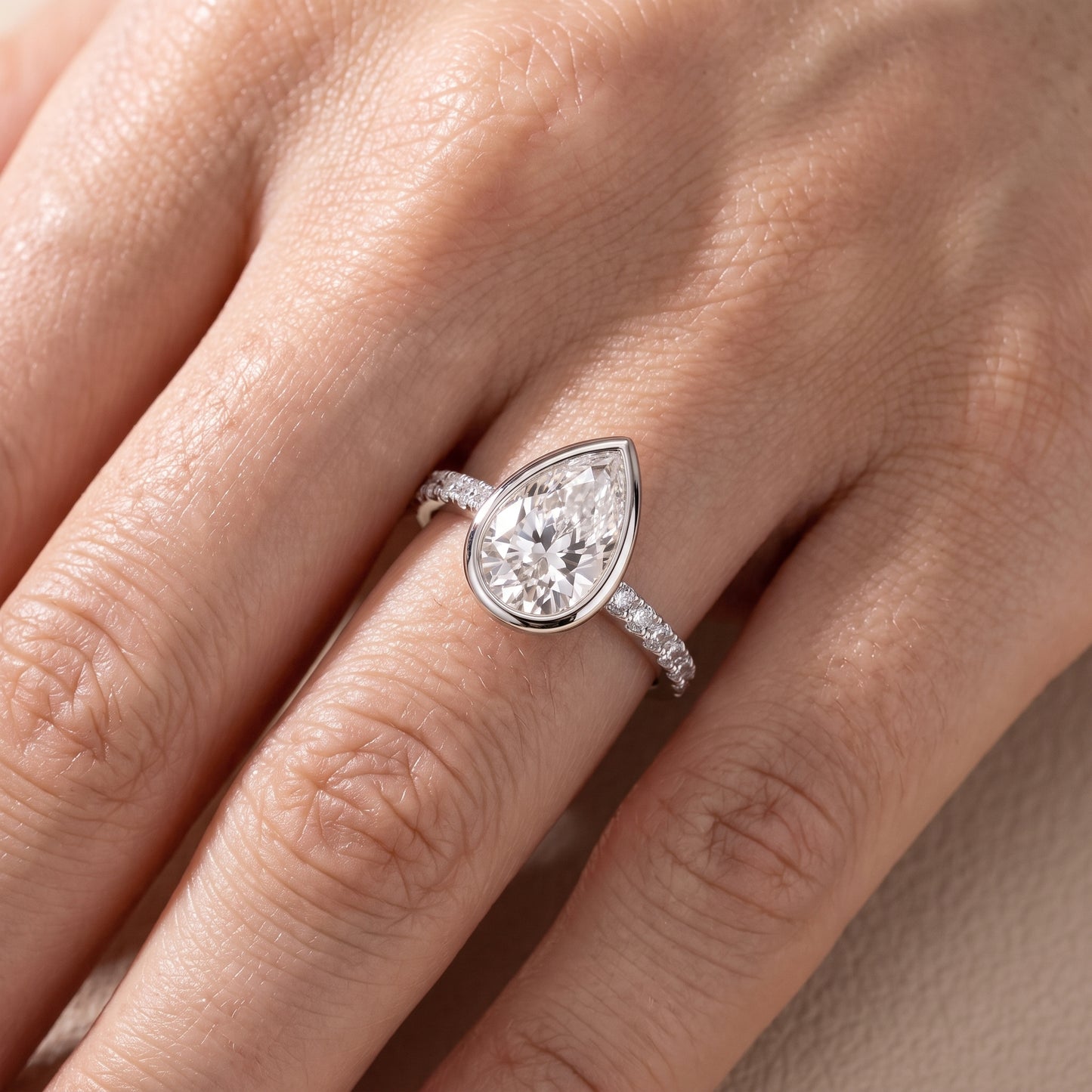 Cora Bezel Pavé Pear Diamond Ring in Platinum - lifestyle.jpg