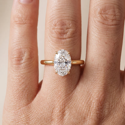 Evie Solitaire Six-Prong Oval Diamond Engagement Ring in Yellow Gold - lifestyle.jpg