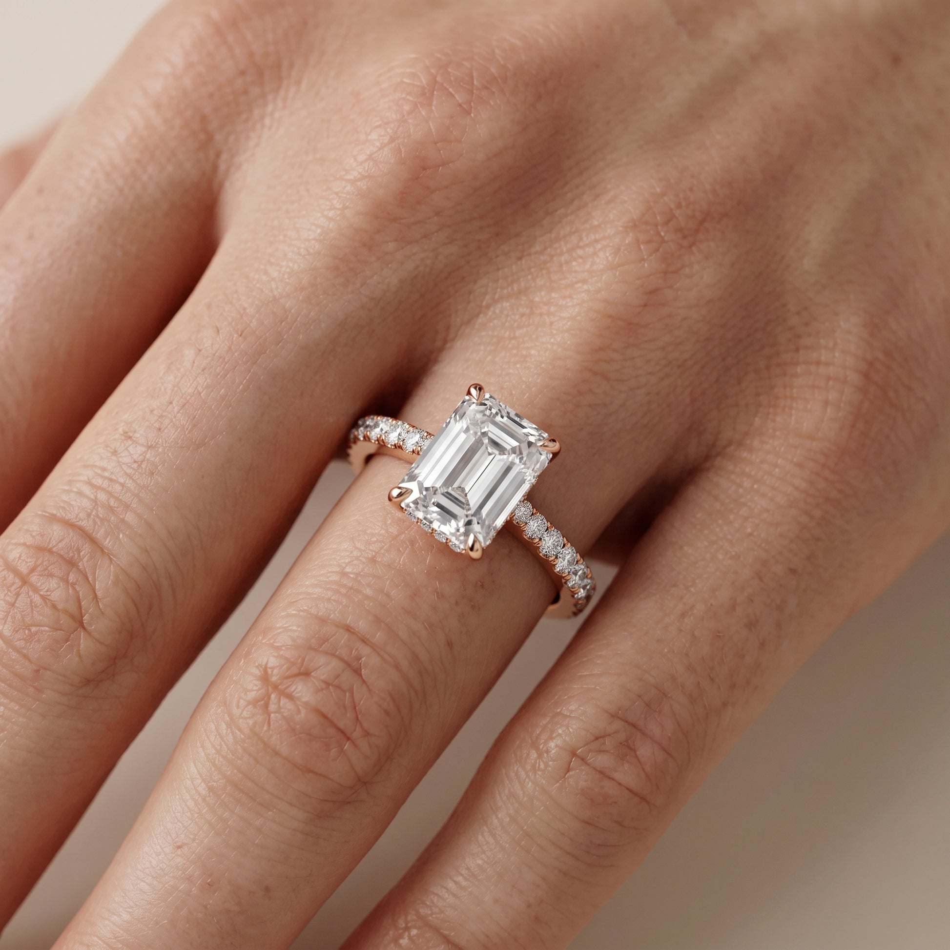 Gia Hidden Halo Pavé Emerald Diamond Ring in Rose Gold - lifestyle.jpg