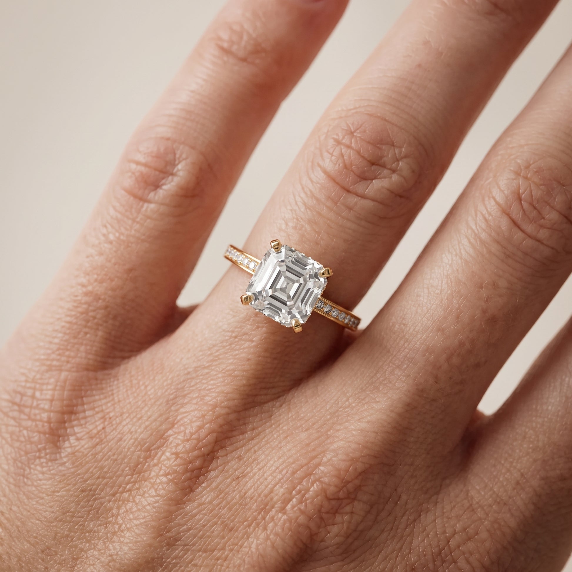 Naia Hidden Halo Asscher Diamond Ring in Yellow Gold - lifestyle.jpg