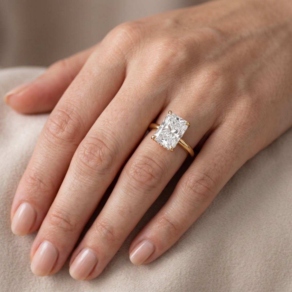 Amaya Hidden Halo Radiant Diamond Engagement Ring in Yellow Gold - lifestyle.jpg