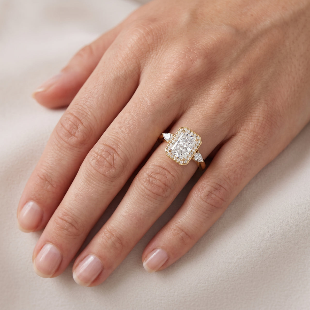 Eliza Halo Sidestone Radiant Diamond Engagement Ring in Yellow Gold - lifestyle.jpg