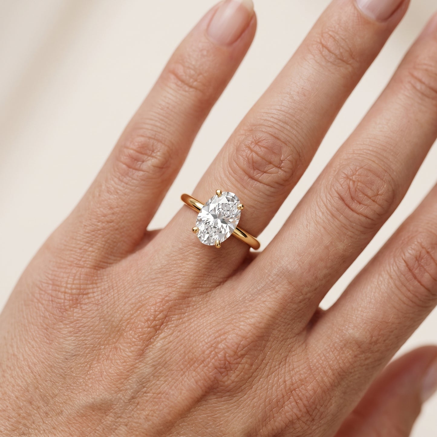 Wren Solitaire Oval Diamond Ring in Yellow Gold - lifestyle.jpg
