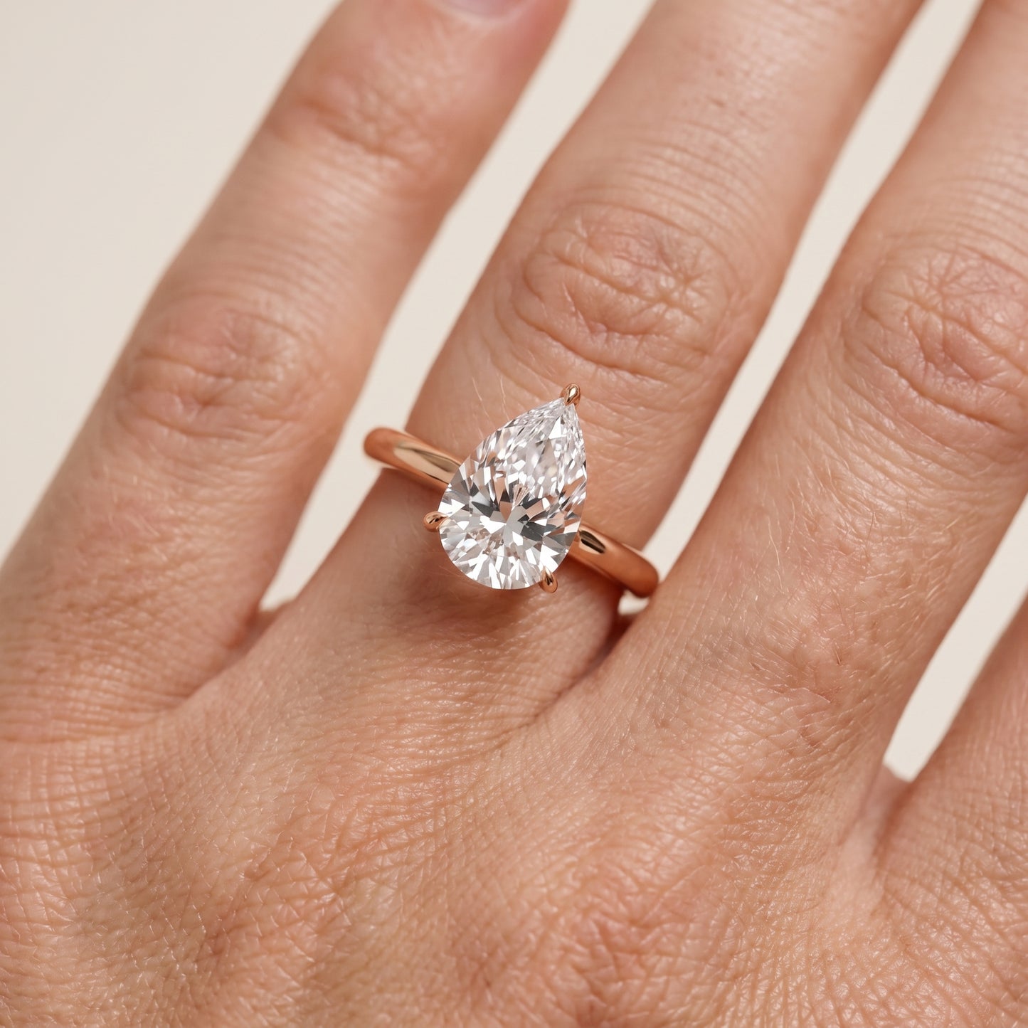 Evie Solitaire Six-Prong Pear Diamond Engagement Ring in Rose Gold - lifestyle.jpg