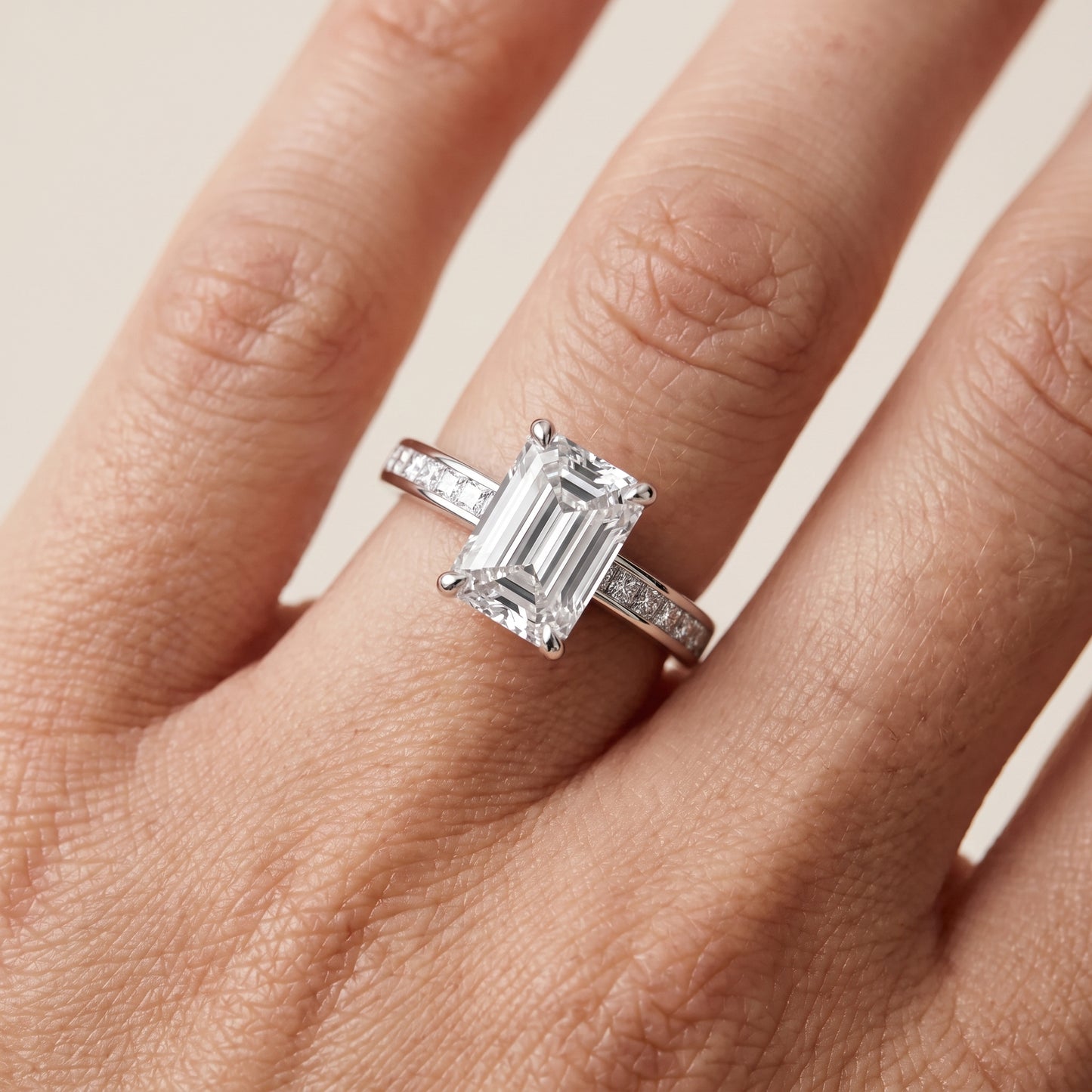 Maren Sidestone Channel Set Emerald Diamond Engagement Ring in Silver - lifestyle.jpg