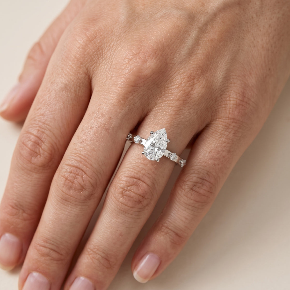 Elena Radiance Solitaire Pear Diamond Engagement Ring in White Gold - lifestyle.jpg