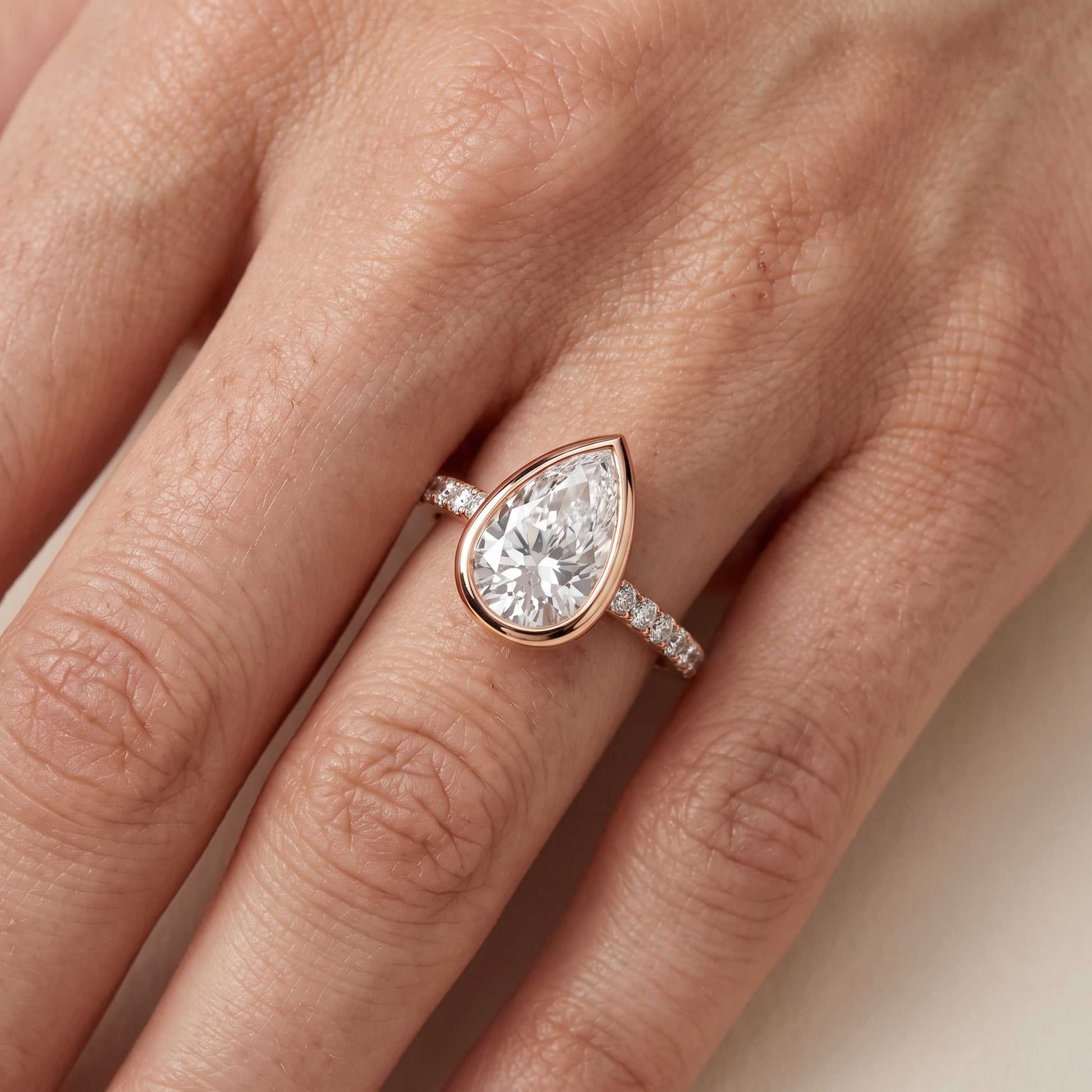 Cora Bezel Pavé Pear Diamond Ring in Rose Gold - lifestyle.jpg