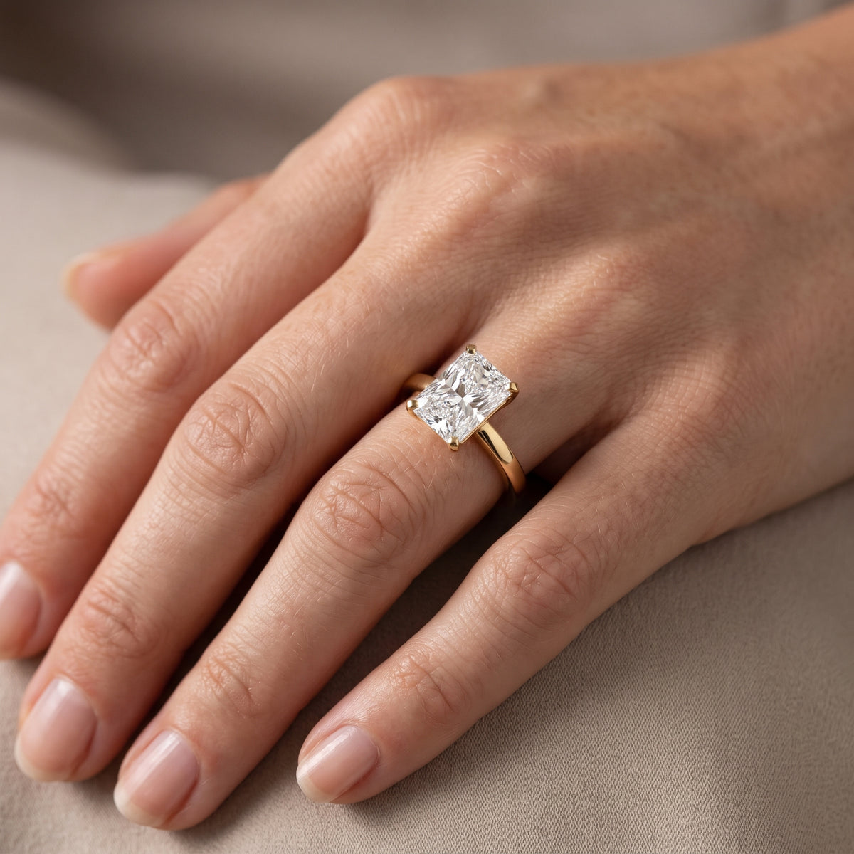 Liana Solitaire Claw Prong Radiant Diamond Engagement Ring in Yellow Gold - lifestyle.jpg