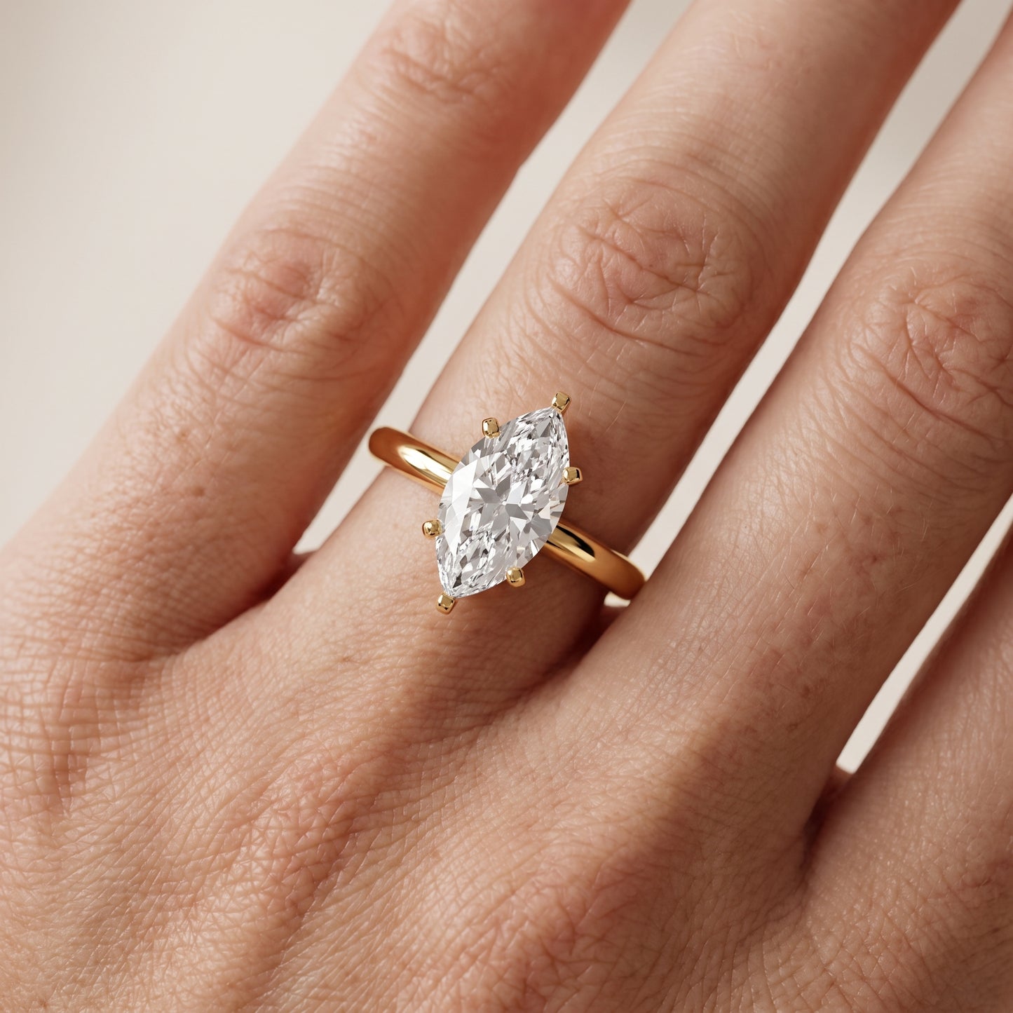 Wren Solitaire Marquise Diamond Ring in Yellow Gold - lifestyle.jpg