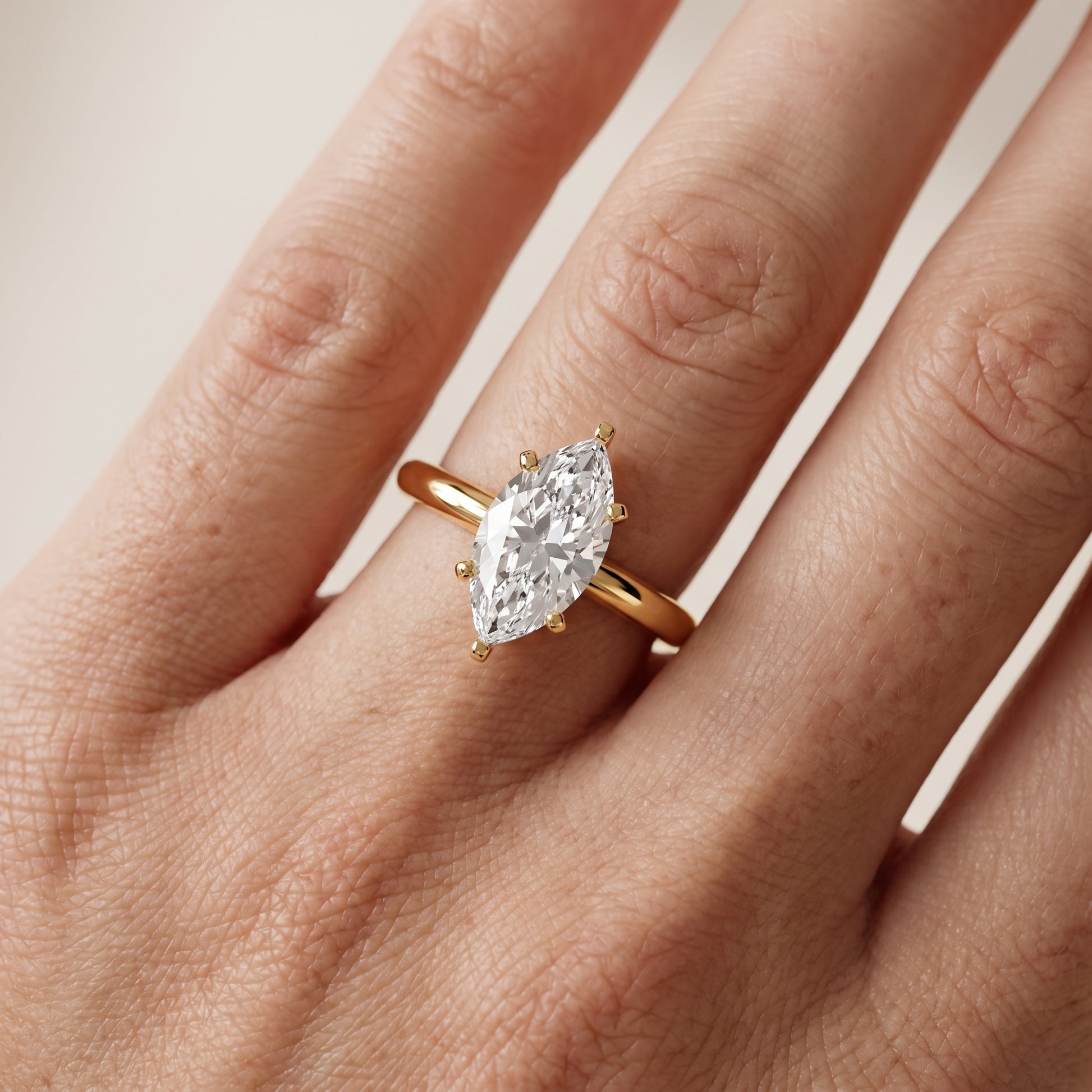Wren Solitaire Marquise Diamond Ring in Yellow Gold - lifestyle.jpg