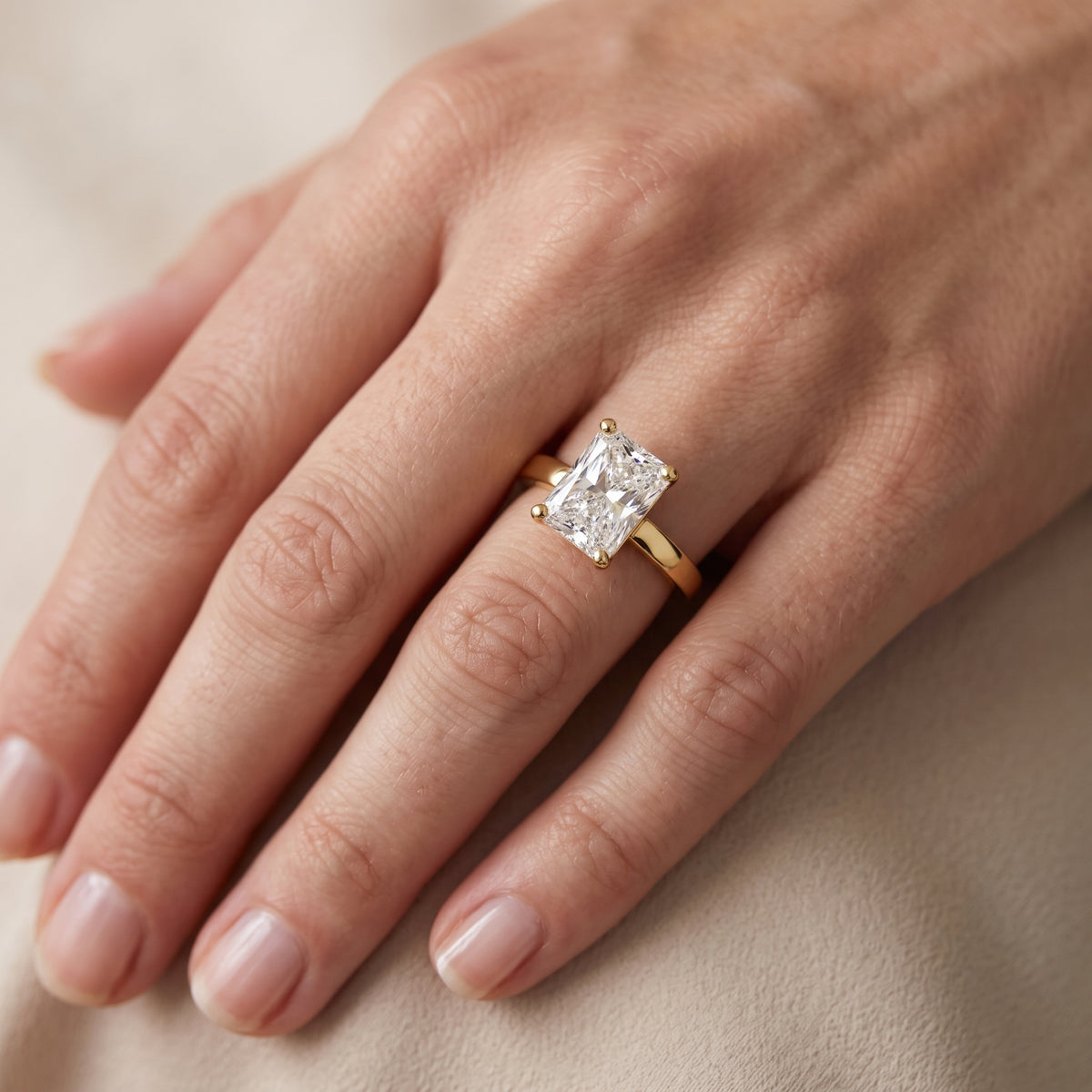 Delia Solitaire Radiant Diamond Engagement Ring in Yellow Gold - lifestyle.jpg