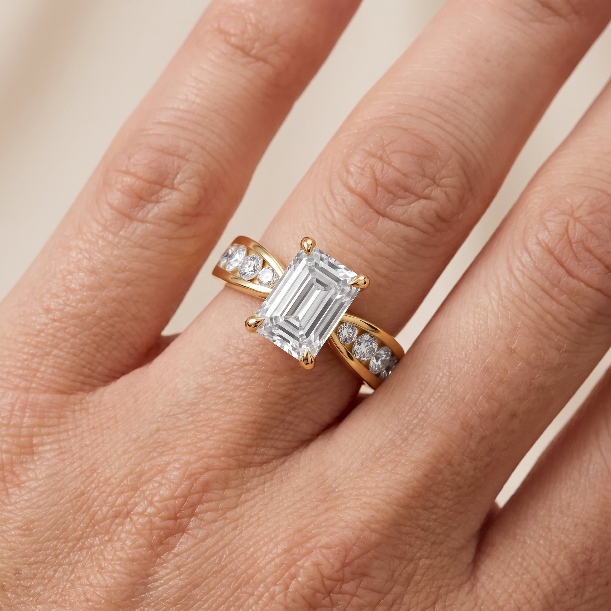Noor Channel Set Sidestone Emerald Diamond Engagement Ring in Yellow Gold - lifestyle.jpg