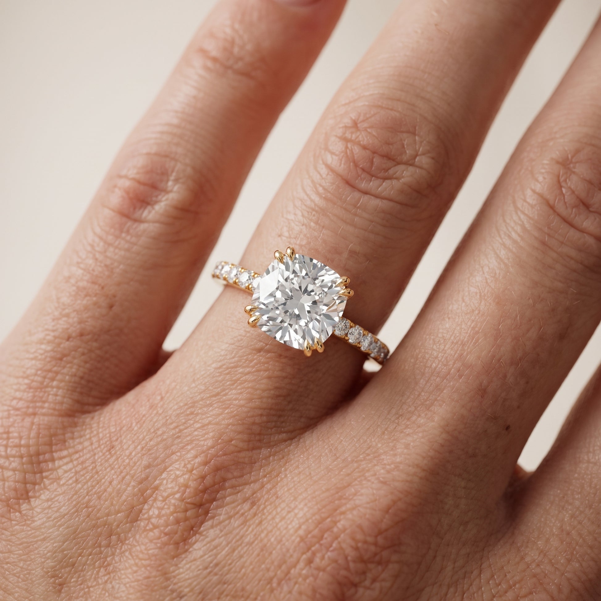 Novara Solitaire Pavé Cushion Diamond Ring in Yellow Gold - lifestyle.jpg