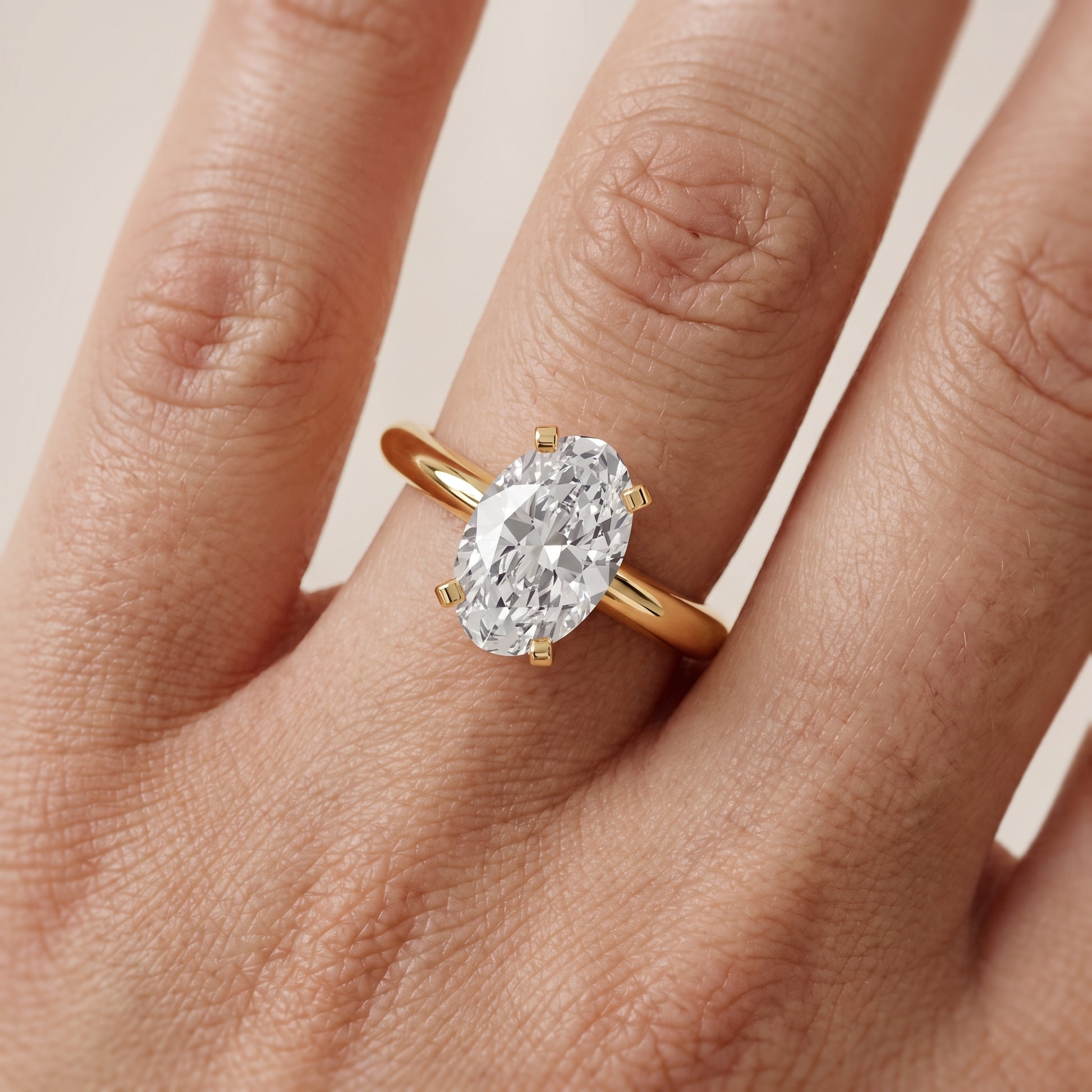 Amira Six-Prong Solitaire Oval Diamond Engagement Ring in Yellow Gold - lifestyle.jpg