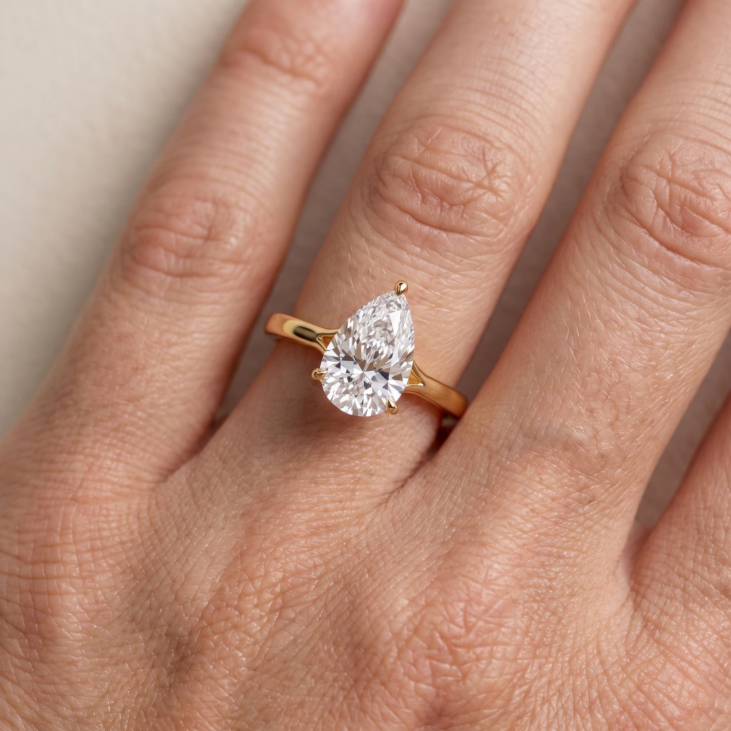 Anais Trellis Solitaire Pear Diamond Engagement Ring in Yellow Gold - lifestyle.jpg