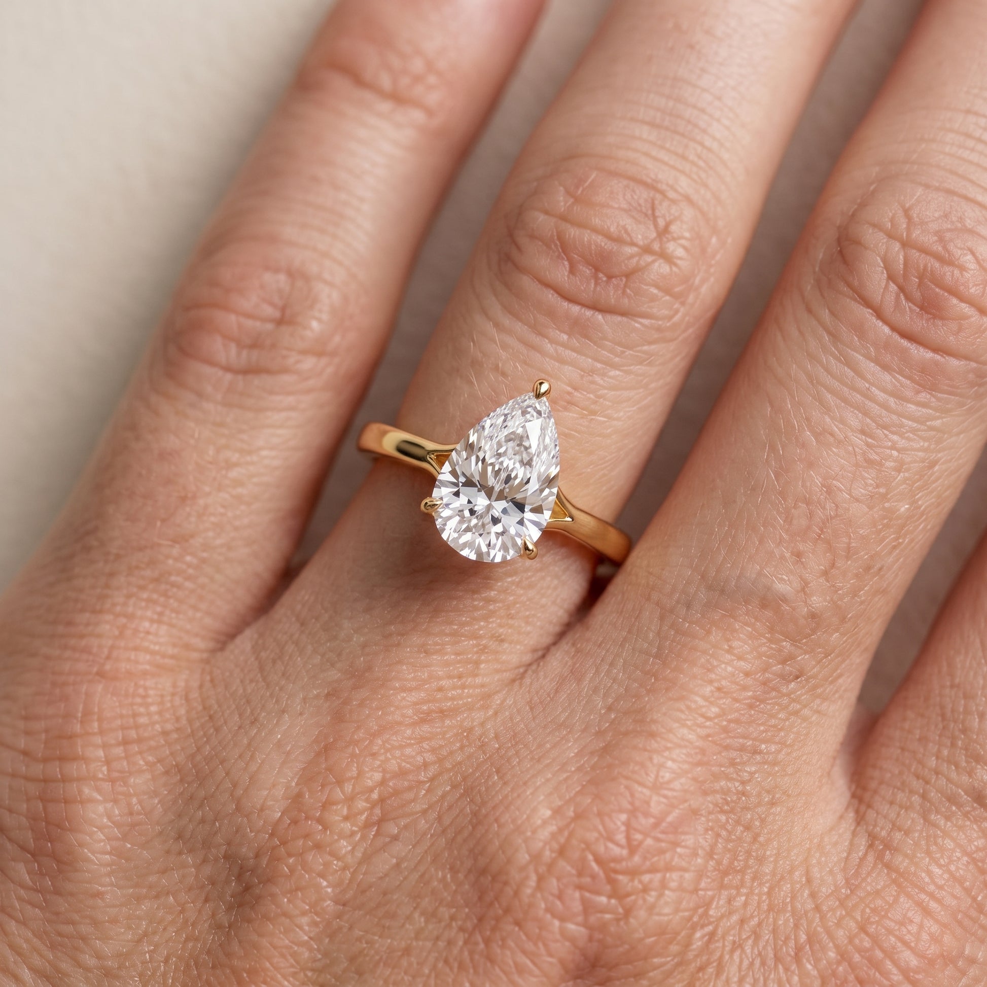 Anais Trellis Solitaire Pear Diamond Engagement Ring in Yellow Gold - lifestyle.jpg