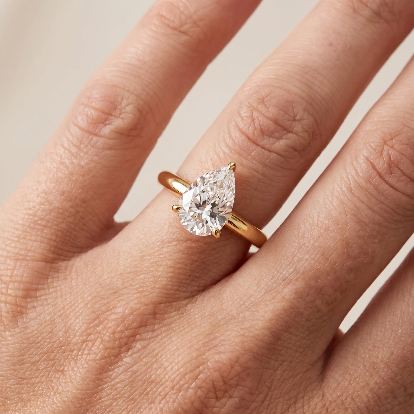 Kalia Knife Edge Solitaire Pear Diamond Engagement Ring in Yellow Gold - lifestyle.jpg