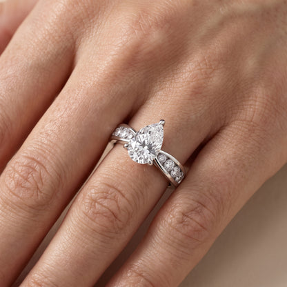 Noor Channel Set Sidestone Pear Diamond Engagement Ring in Silver - lifestyle.jpg