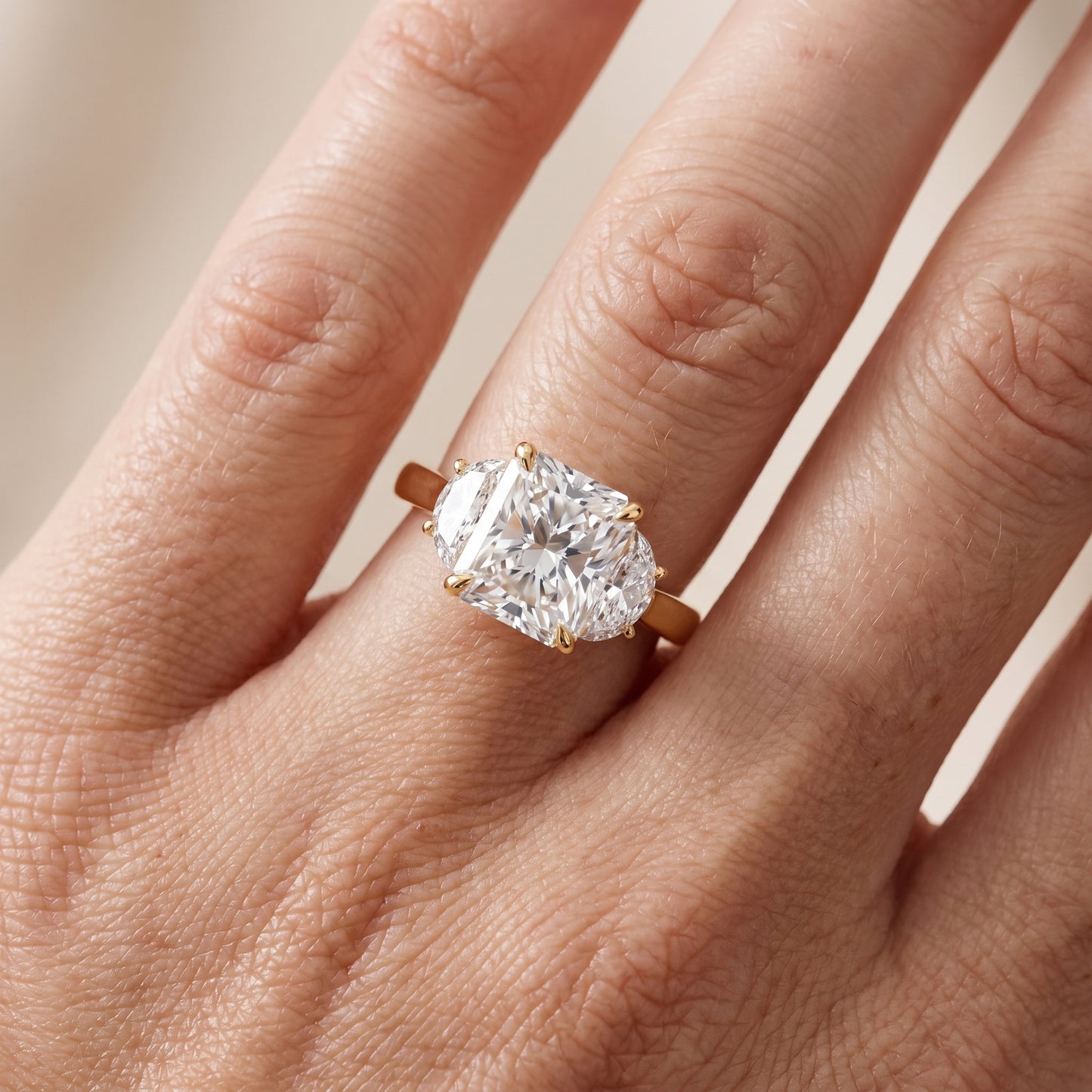 Romy Three-Stone Radiant Diamond Engagement Ring in Yellow Gold - lifestyle.jpg